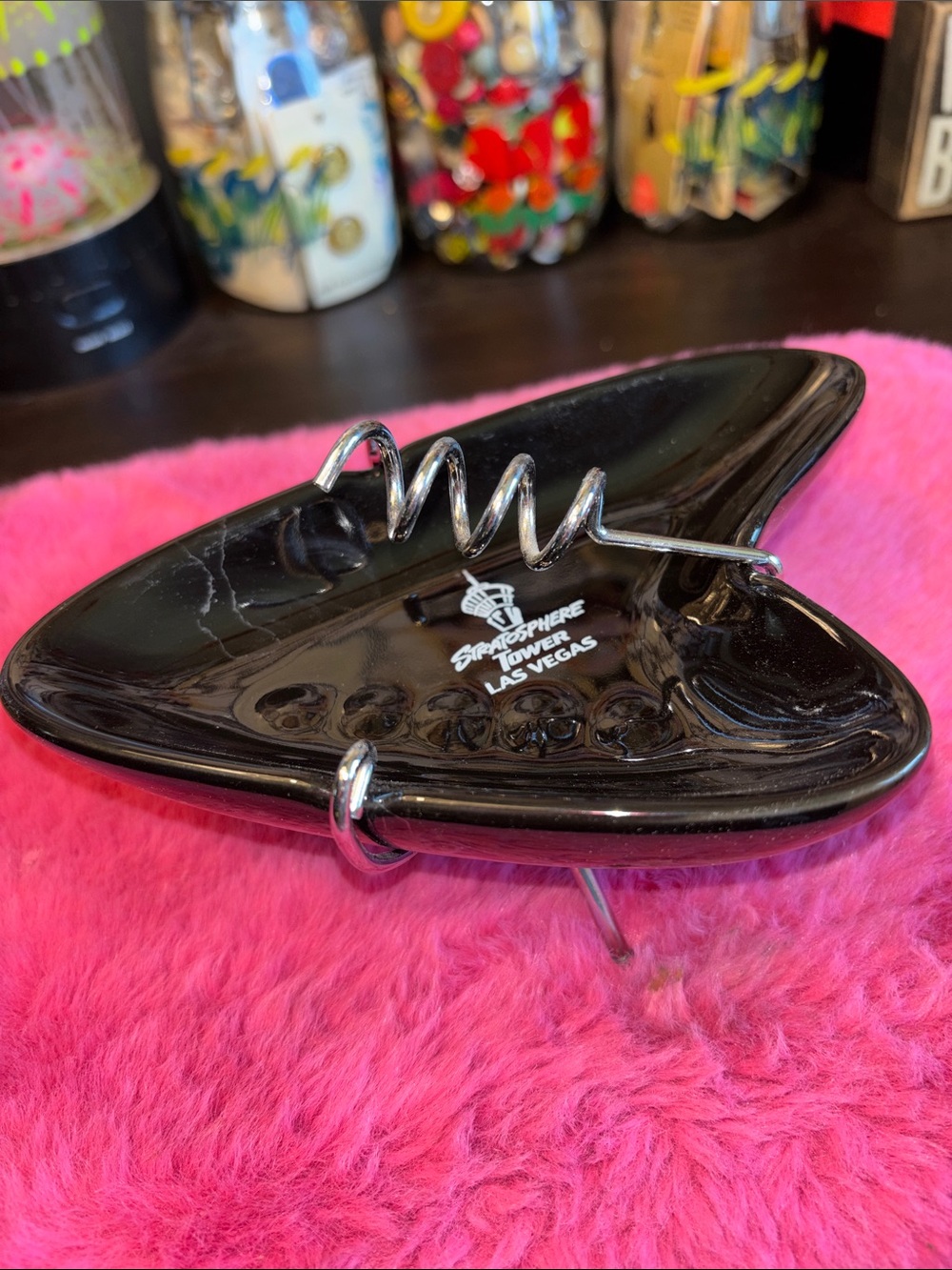NWT VINTAGE black ceramic boomerang-style ashtray featuring the "Stratosphere T